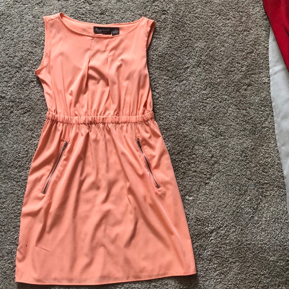 A peach color, solid dress